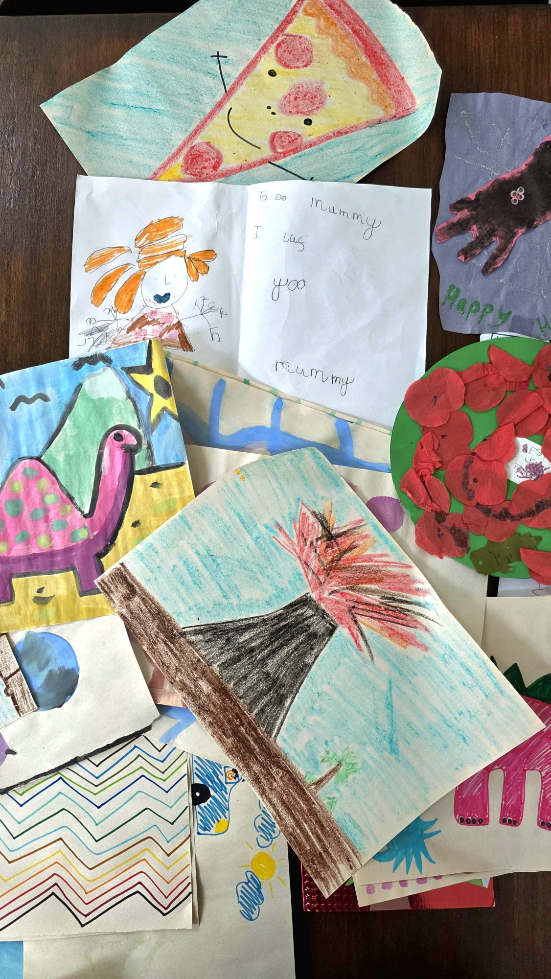 Collection of children's drawings, paintings and handwritten notes ready to be curated