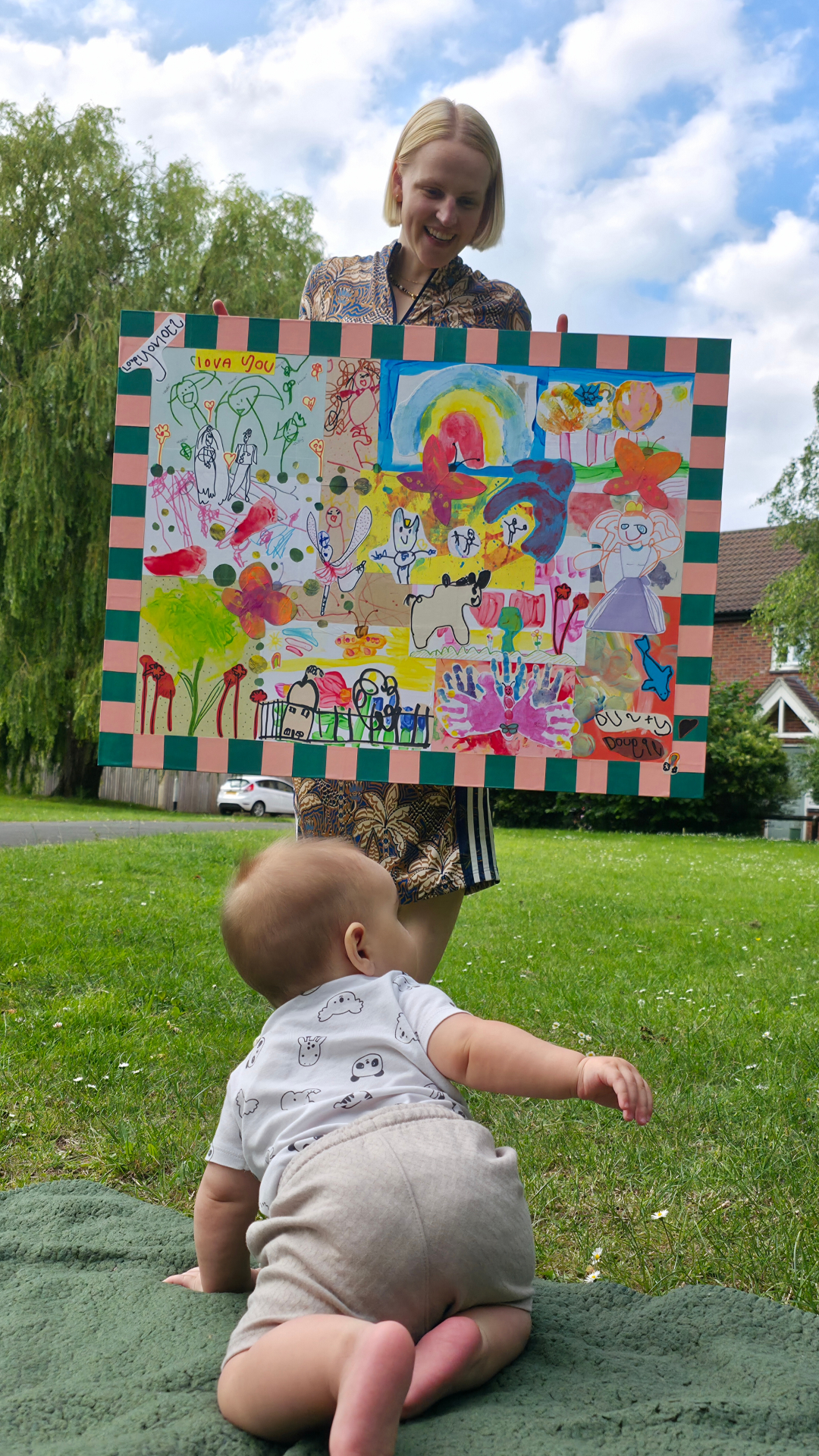 Child standing in front of her bespoke Littlest Galleries framed artwork